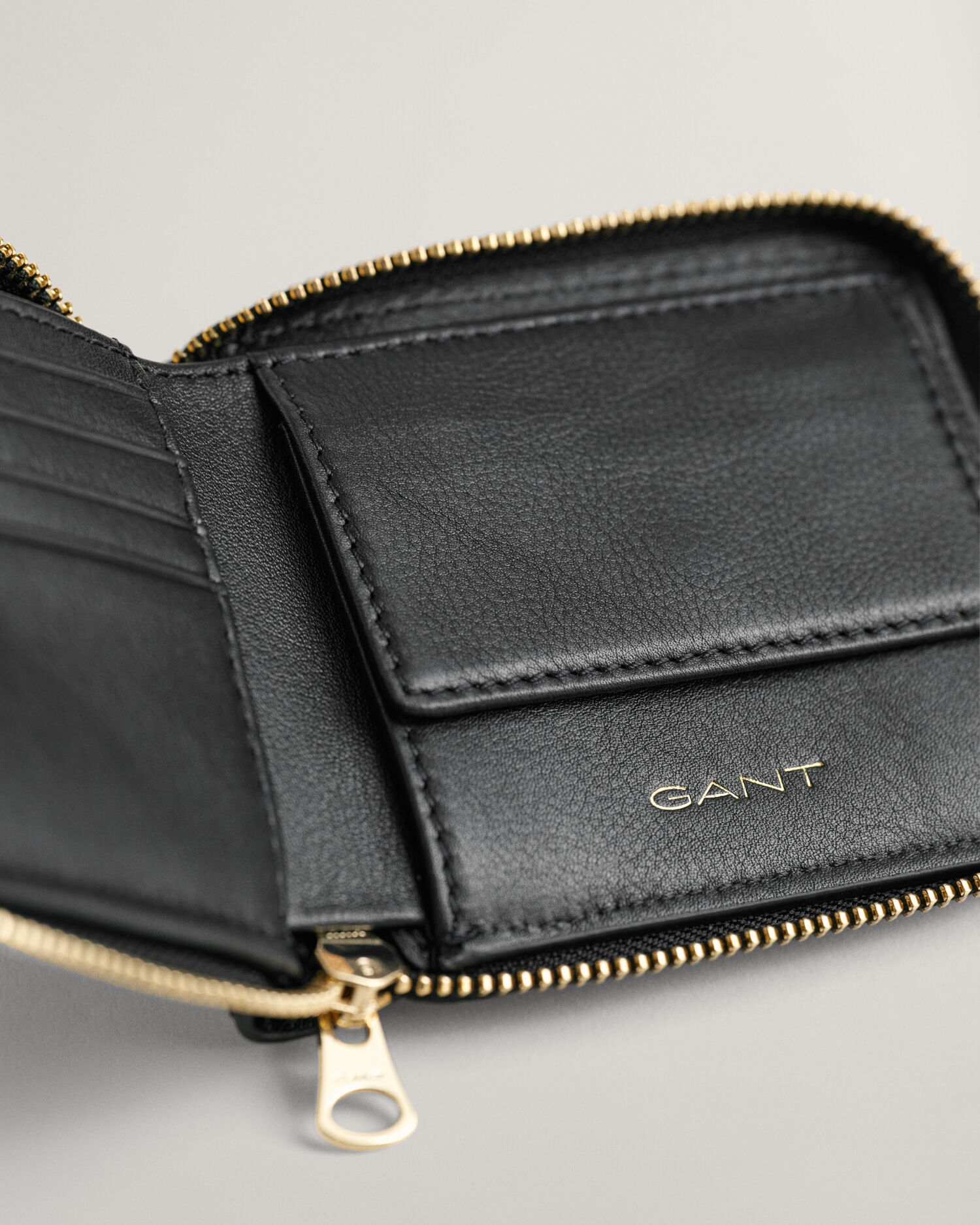 GG Marmont zip around wallet in black leather and GG Supreme | GUCCI® US